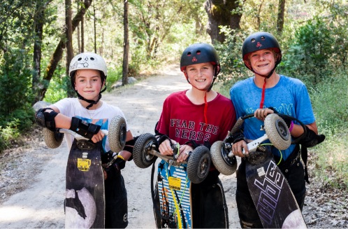 Yosemite Sierra Summer Camp campers riding dirtboards
